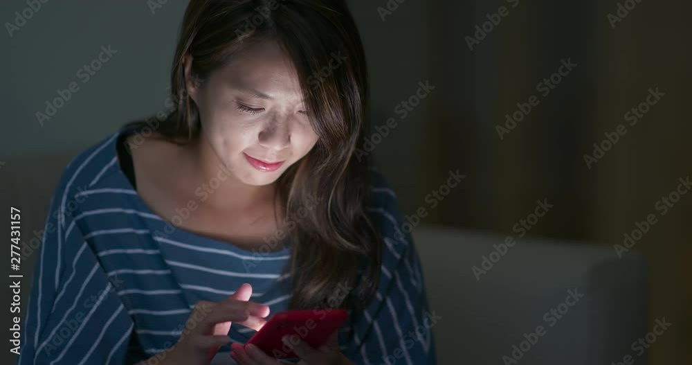 Young woman work on mobile phone at night Young woman work on mobile phone at night