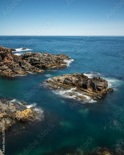 Crystal clear pristine blue water surrounded by a rugged rocky coastline. Elliston, Newfoundland Canada.   © Scott Heaney