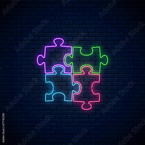 Neon puzzle pieces. Glowing neon icon of logical concept. Thinking game symbol.