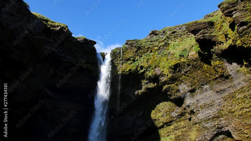Kvernufoss waterfall in Iceland. Icelandic landscape in spring sun light. Kvernufoss waterfall in Iceland. Icelandic landscape in spring sun light.
