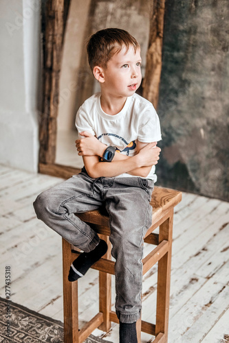boy sitting on a stool © ganusik1304