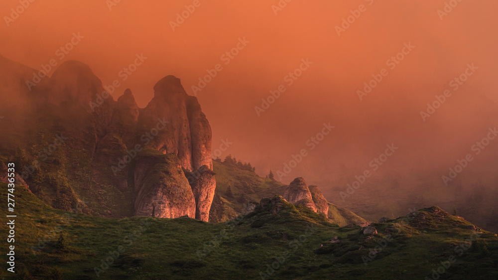 Rocky landscape in the mist of the sunrise