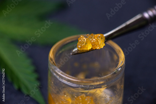 Macro detail of cannabis concentrate live resin extracted from medical marijuana on a dabbing tool