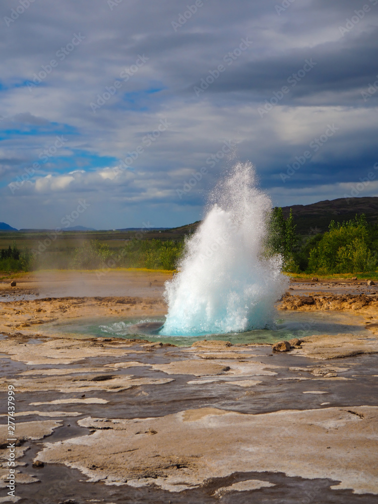 Strokkur geyser beginning to erupt at Geysir, Iceland