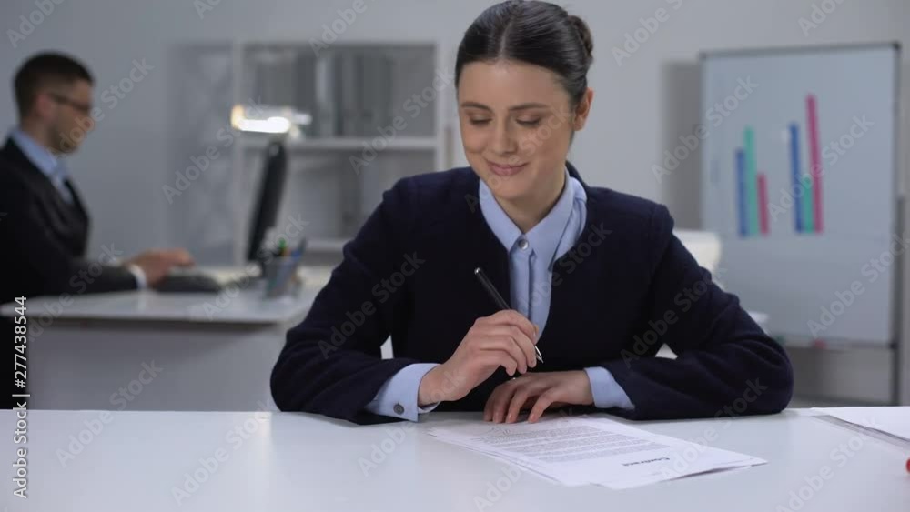 Shy female manager working on documents, dreaming about male colleague, love Shy female manager working on documents, dreaming about male colleague, love