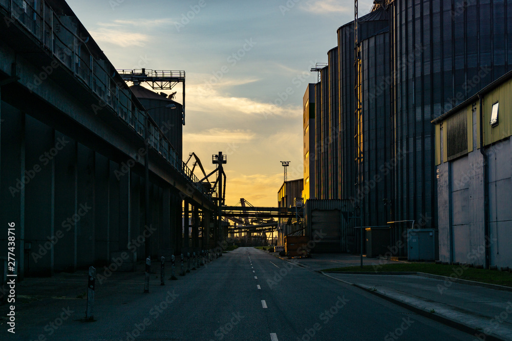 street at night - evening sky - industrial buildings