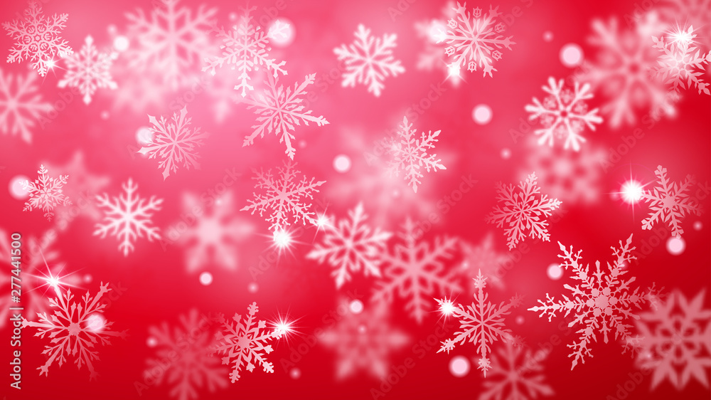 Christmas blurred background of complex defocused big and small falling snowflakes in red colors with bokeh effect