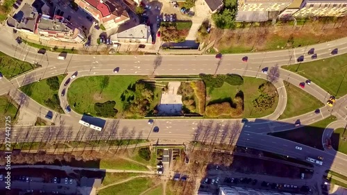 Top aerial view of traffic on elliptical road static