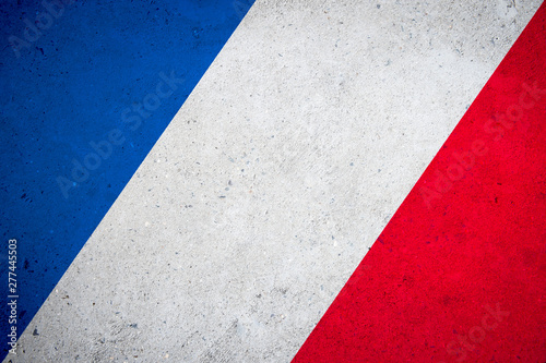 French flag tricolour background on textured grunge concrete wall