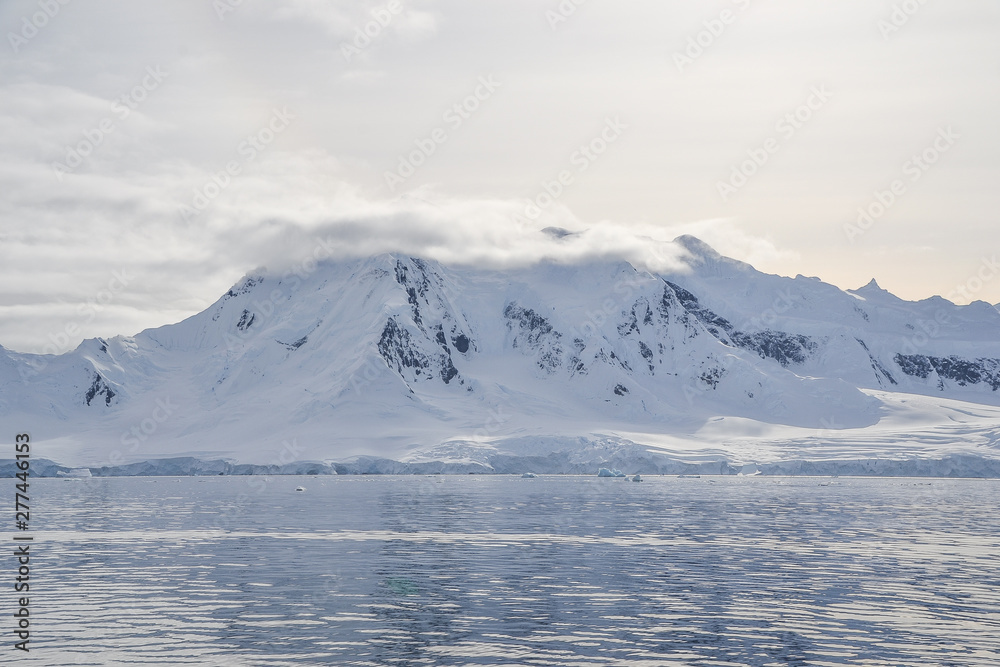 Antarctic mountain with low hanging clouds