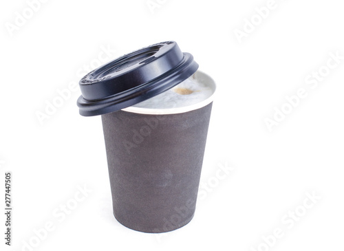 Disposable black paper cup with cappuccino, latte. 