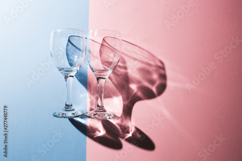 Creative Fun Colorful Pastel Pink And Blue Colors Abstract Design Background, Light And Wine Glass