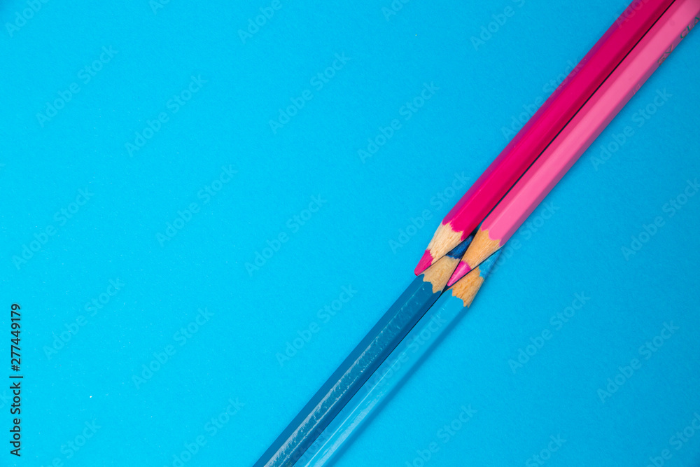 Minimal creative color pencils crayon geometry flat lay top view background with blue and pink colors pencil Minimal creative color pencils crayon geometry flat lay top view background with blue and pink colors pencil