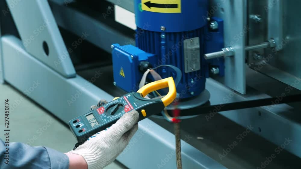Engineer holding in hand multimeter professional multifunctional manual device