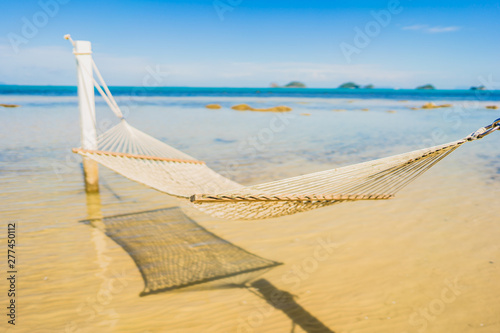 Beautiful empty hammock around tropical beach sea ocean for holiday vacation