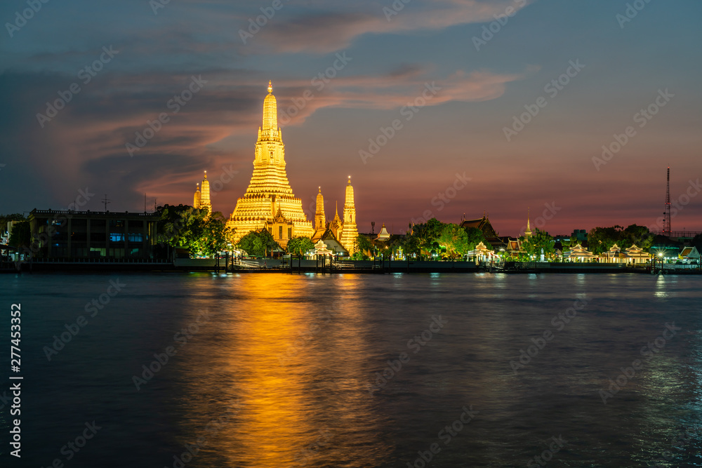 Wat Arun, Buddhist temple at  Chao Phraya river side in evening, Bangkok, Thailand.