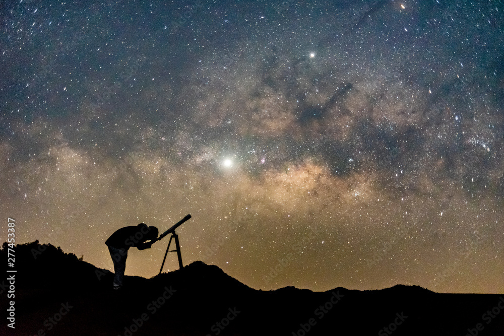 Silhouette of man watching star in telescope against milky way galaxy with  stars and space dust in the universe. Stock Photo | Adobe Stock