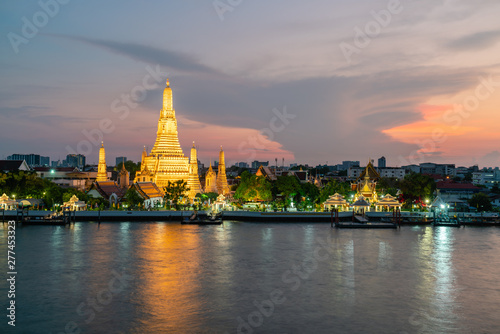Wat Arun, Buddhist temple at Chao Phraya river side in evening, Bangkok, Thailand.