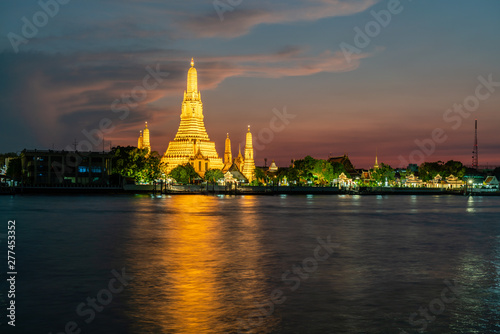 Wat Arun, Buddhist temple at Chao Phraya river side in evening, Bangkok, Thailand.