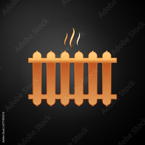Gold Heating radiator icon isolated on black background. Vector Illustration