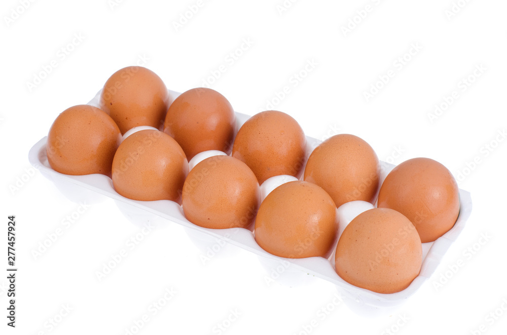 Chicken brown eggs and egg yolk in white form. Chicken brown eggs and egg yolk in white form.