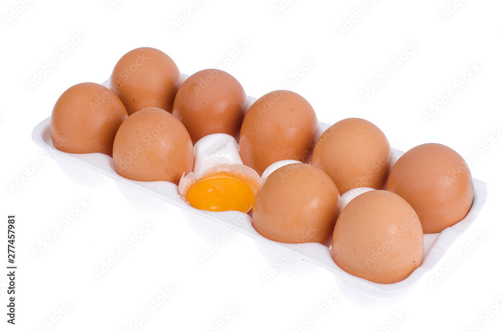 Chicken brown eggs and egg yolk in white form. Chicken brown eggs and egg yolk in white form.