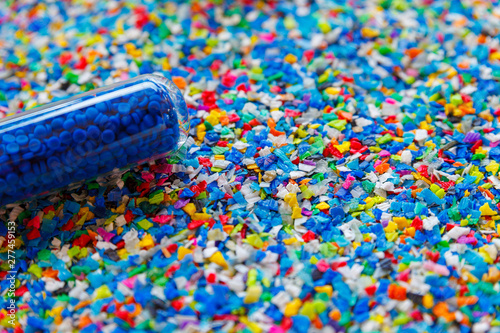 Crushed plastic granules for recycling.  Plastic crusher. Recycled plastic with mixed colors. The concept of recycled plastic used