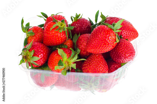 Fresh sweet red strawberries in plastic container. 