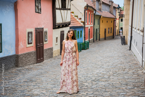 Cobblestone street and colorful 16th century cottages of artisans known as Golden Lane inside the castle walls Prague Czech Republic photo