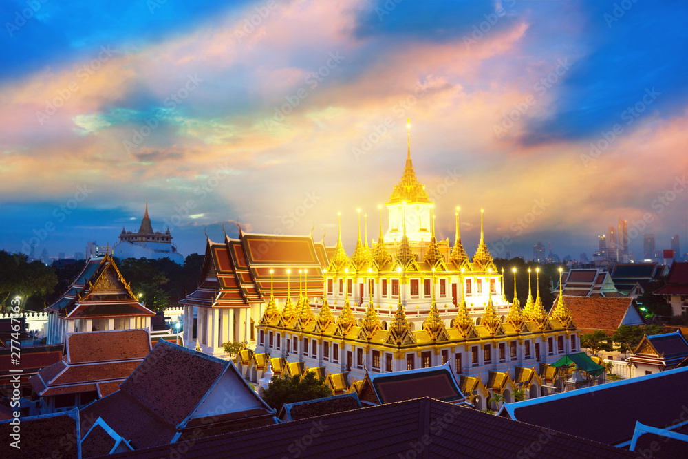 Wat Ratchanaddaram Temple in Bangkok Thailand in morning sunrise beautiful blue sunlight sky
