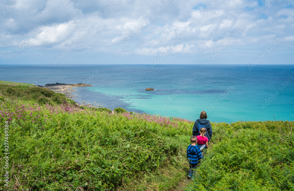 Family walking on the Cornish coast
