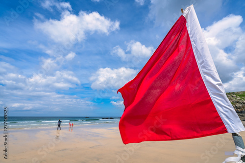Red warning flag on Cornish beach