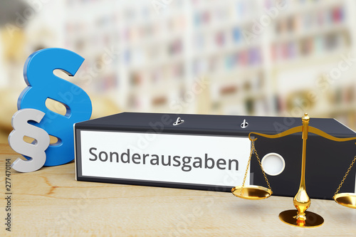 Sonderausgaben – Recht/Gesetz. Ordner auf Schreibtisch mit Beschriftung neben Paragraf und Waage. Anwalt photo