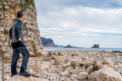 Man standing on the rocky coast in Montenegro