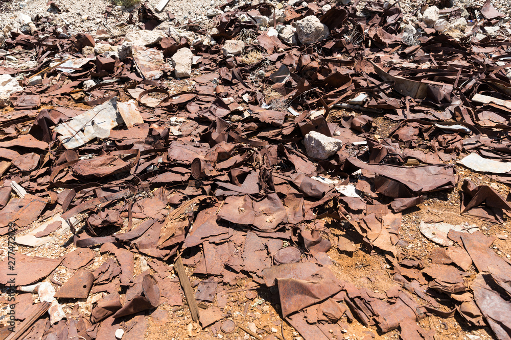 Metal straps trash and rusty tin cans from Ludwig mine in the desert