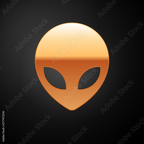 Gold Alien icon isolated on black background. Extraterrestrial alien face or head symbol. Vector Illustration