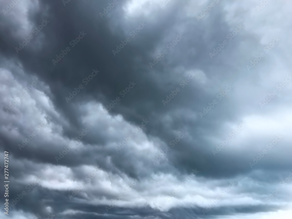 background of heavy dramatic dark clouds background of heavy dramatic dark clouds