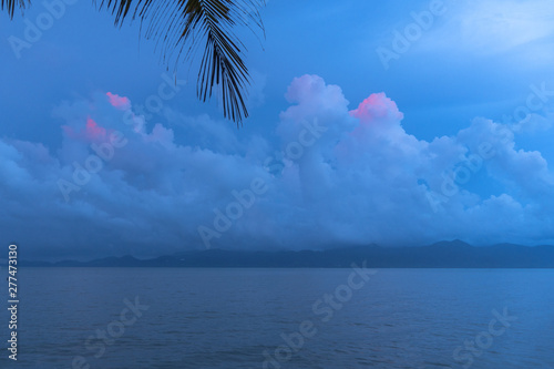 beautiful pink cloud in blue sky at sunrise in rainy season.