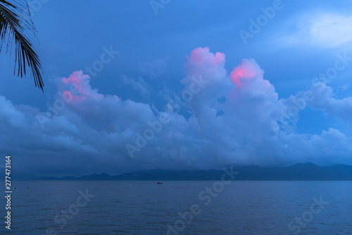 beautiful pink cloud in blue sky at sunrise in rainy season. photo