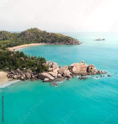 Aerial views over a tropical island in a middle of an archipelago photo