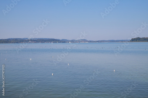 Beautiful view of the Lake with with a small town on the other side © keleny