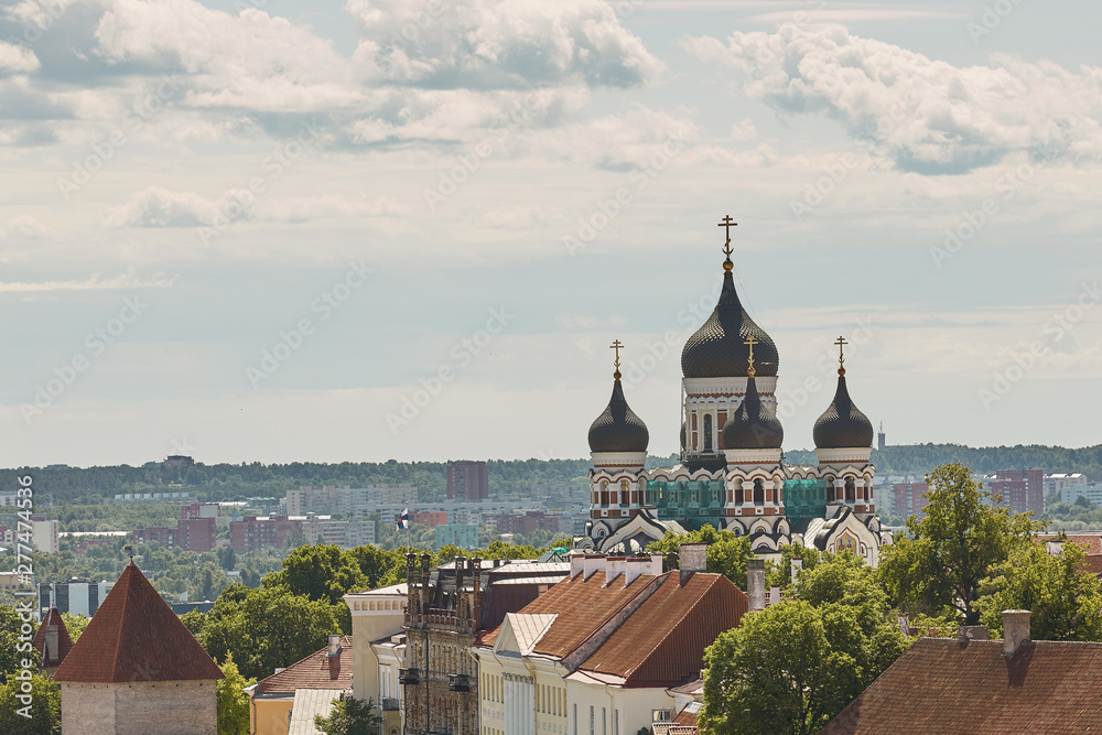 View of the wall surrounding center of the city of Tallinn in Estonia and Alexander Nevsky Cathedral.