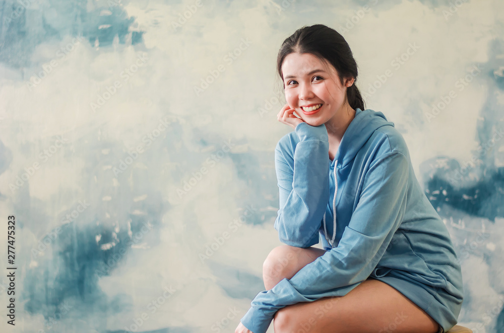 Fashion photo of a beautiful young woman wearing modern sports clothes posing over colorful background. Fashion photo Fashion photo of a beautiful young woman wearing modern sports clothes posing over colorful background. Fashion photo