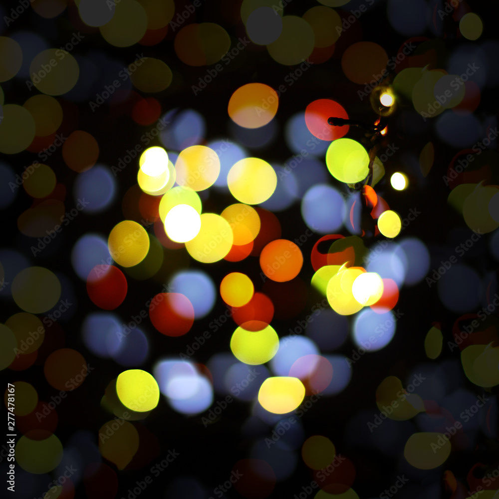 Obraz premium Christmas and happy new year on a blurred bokeh. Glare blurred blank background.
