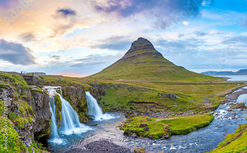 Beautiful natural magical scenery with a waterfall Kirkjufell near the volcano in Iceland. Exotic countries. Amazing places. Popular tourist atraction. (Meditation, antistress - concept).