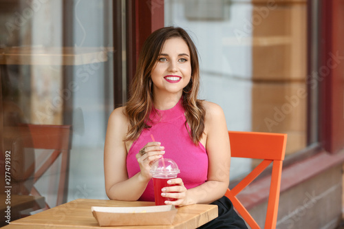 Beautiful young woman with ...