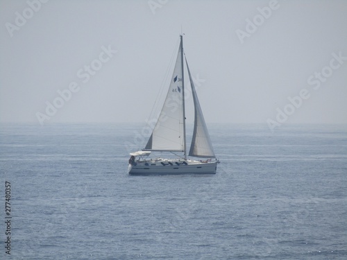 sailing yacht in the sea © jonesyinc