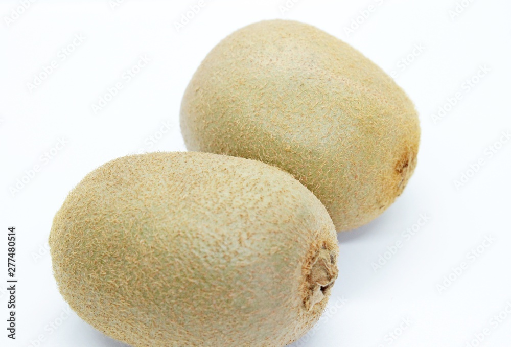 Kiwi is a delicious fruit located on a white background Kiwi is a delicious fruit located on a white background