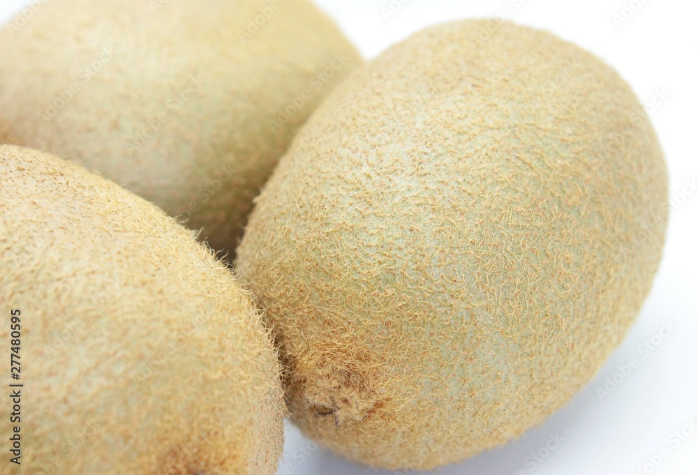 Kiwi is a delicious fruit located on a white background Kiwi is a delicious fruit located on a white background