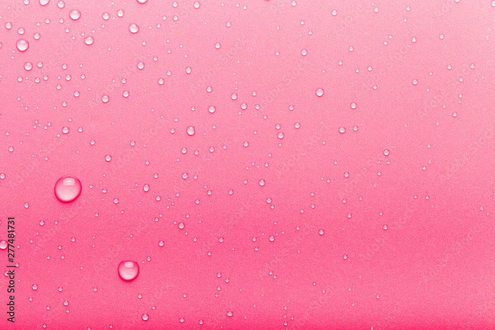 Drops of water on a color background. Pink. Toned Drops of water on a color background. Pink. Toned